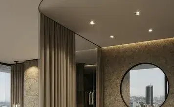 Сучасний інтер'єр з елігантними шторами та круглим дзеркалом